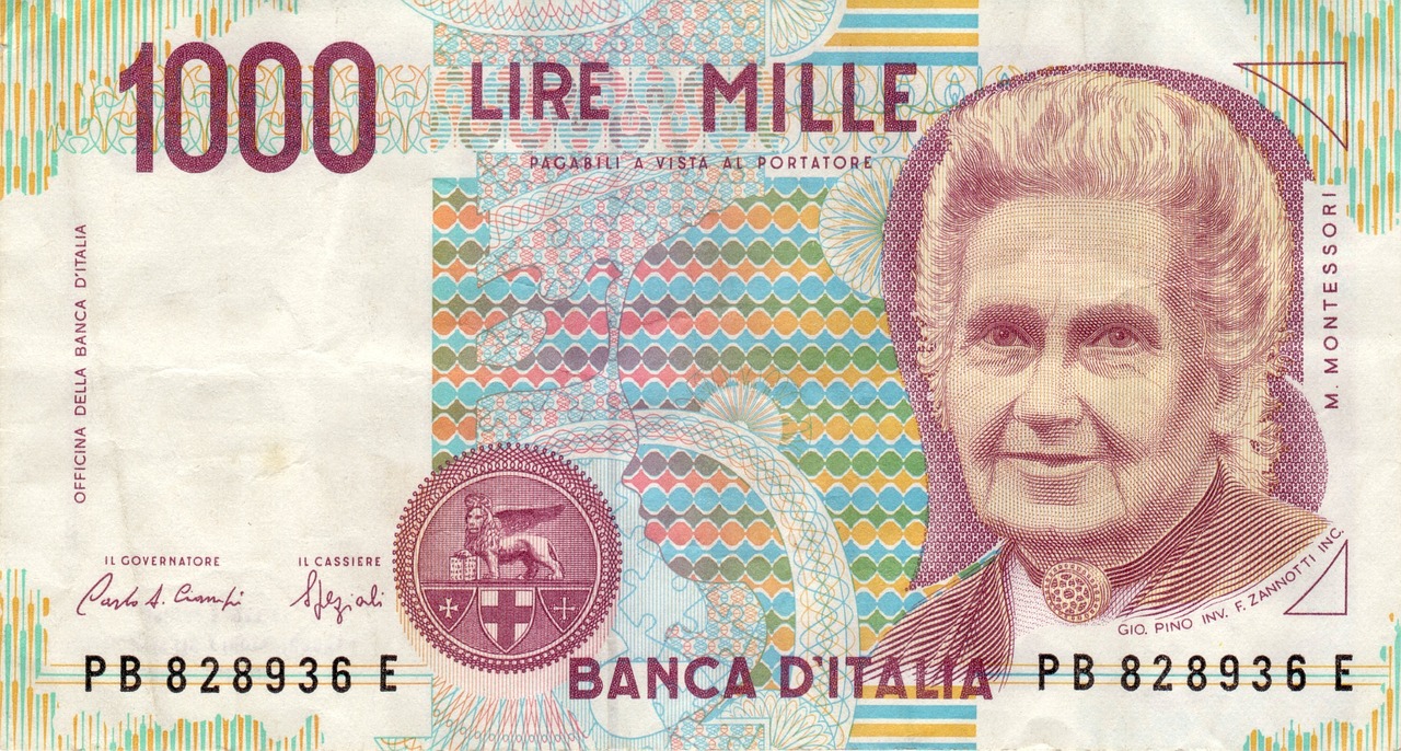 Moneta da 5 lire con delfino, simbolo di valore collezionistico in primo piano.